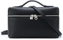 Black leather handbag with a shoulder strap on a white background